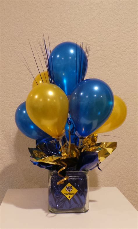 blue and gold graduation centerpieces